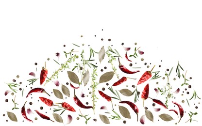 Image of Many different spices flying on white background