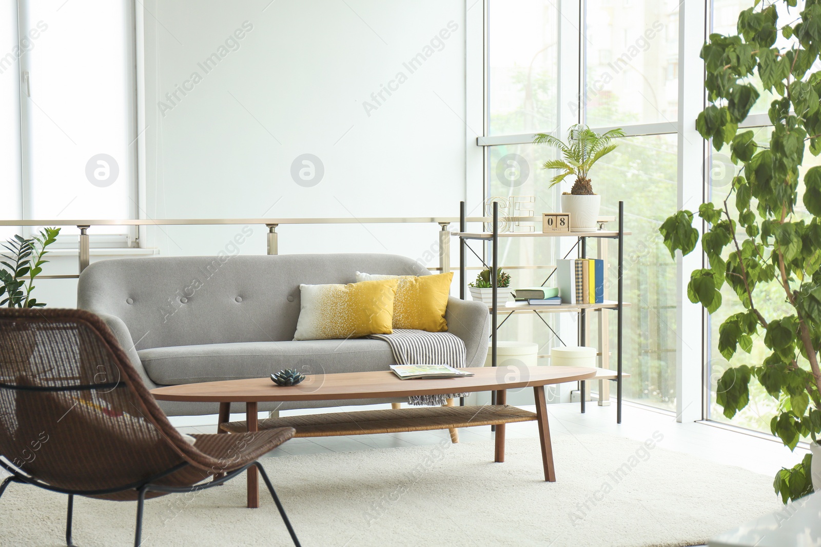 Photo of Elegant living room interior with comfortable sofa and coffee table