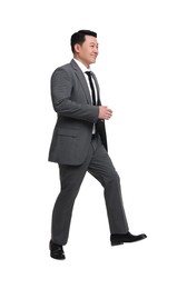 Photo of Businessman in suit walking on white background