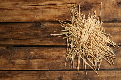 Photo of Dried hay on wooden background, top view. Space for text