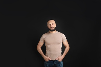 Photo of Portrait of handsome man on black background