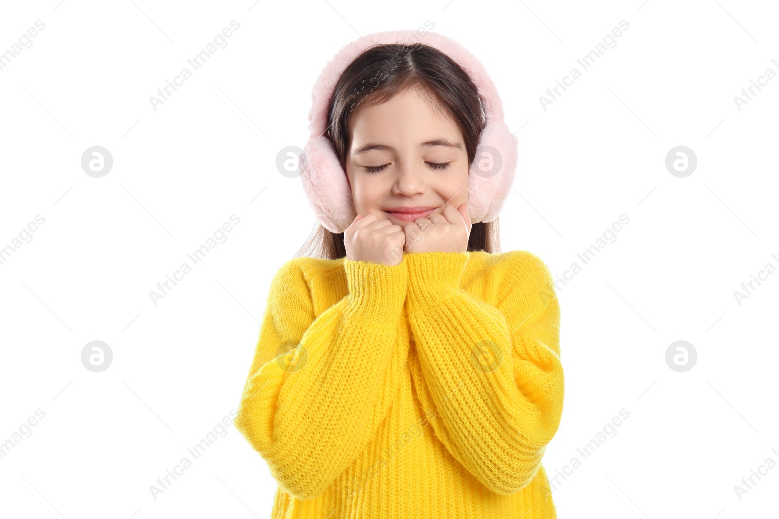 Photo of Cute girl wearing stylish earmuffs on white background
