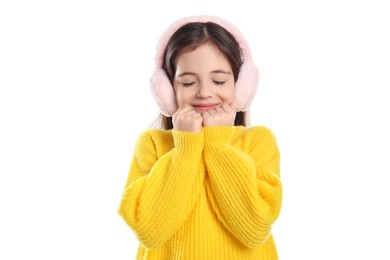 Photo of Cute girl wearing stylish earmuffs on white background