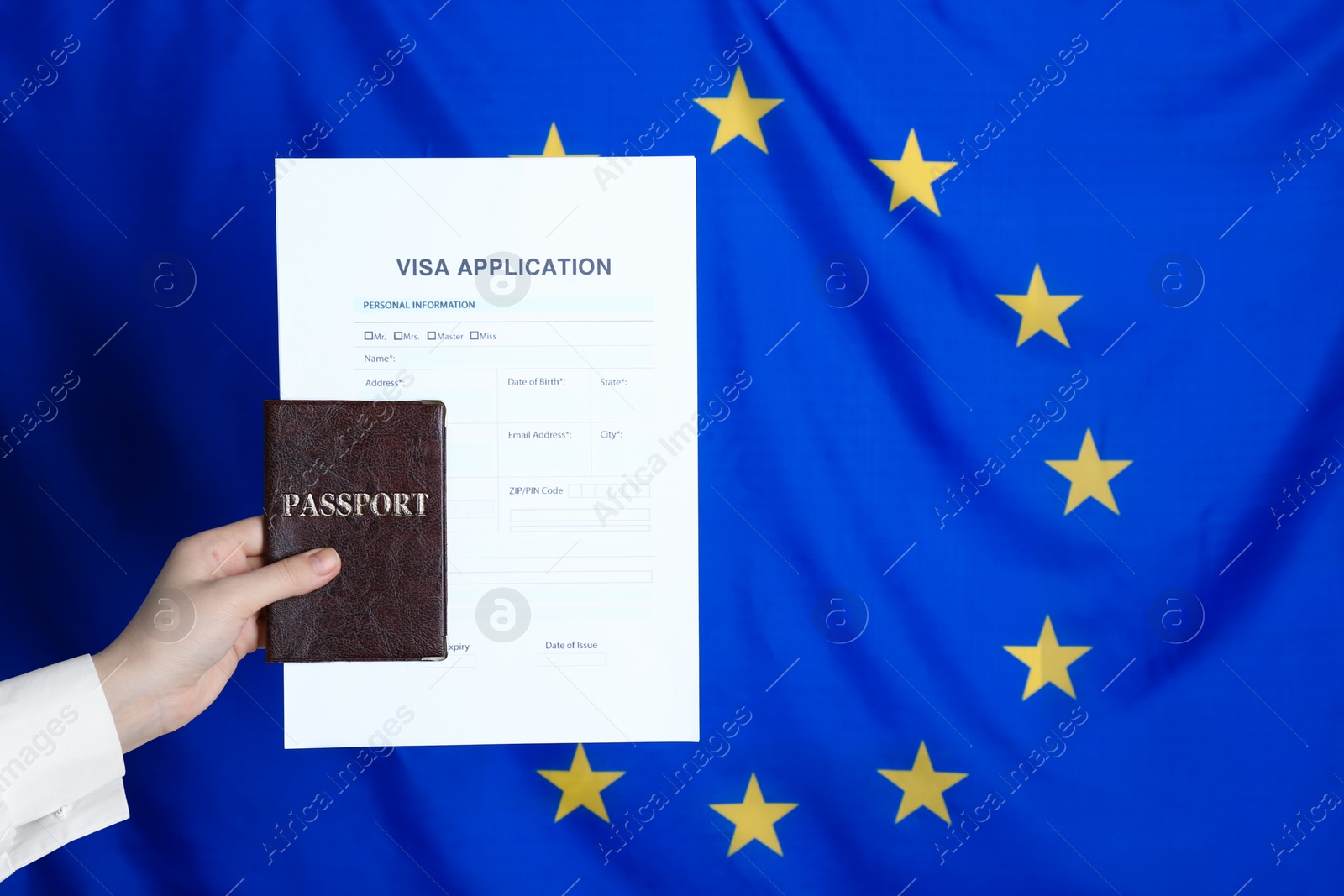 Photo of Woman holding visa application form and passport against European Union flag, closeup. Space for text