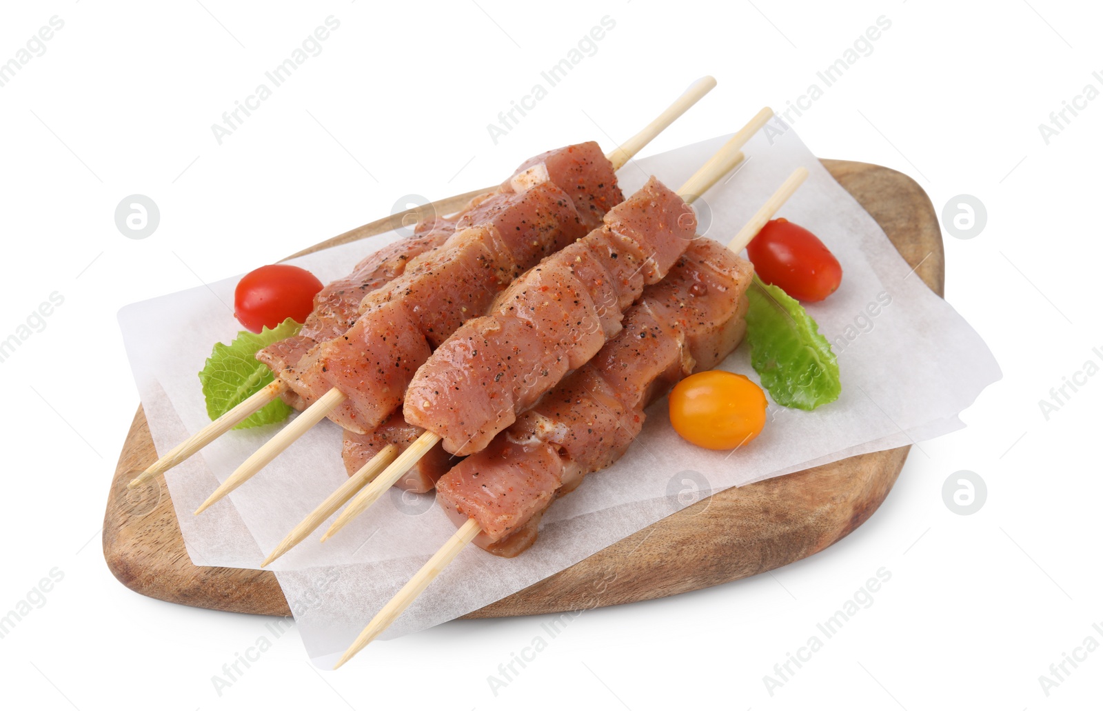 Photo of Wooden skewers with cut raw marinated meat isolated on white