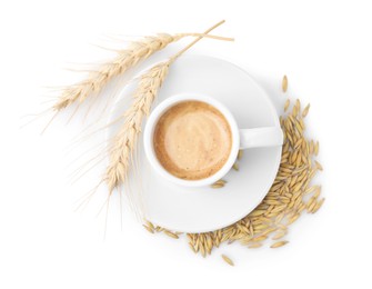 Cup of barley coffee, grains and spikes isolated on white, top view