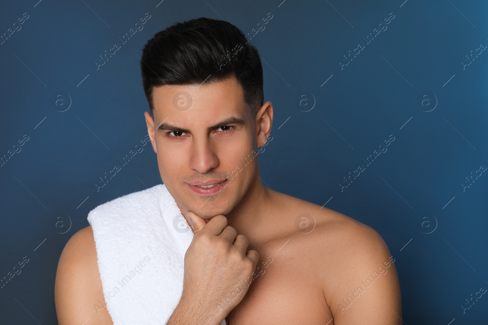 Photo of Handsome man after shaving on blue background