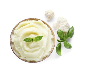 Bowl with tasty cauliflower puree on white background, top view