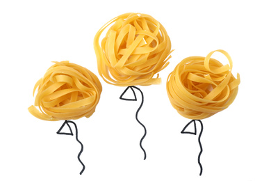 Photo of Balloons made with tagliatelle pasta on white background, top view