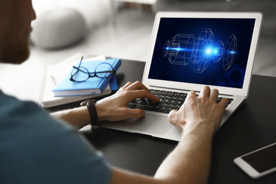 Image of Male engineer working with 3d model of modern equipment on laptop indoors, closeup