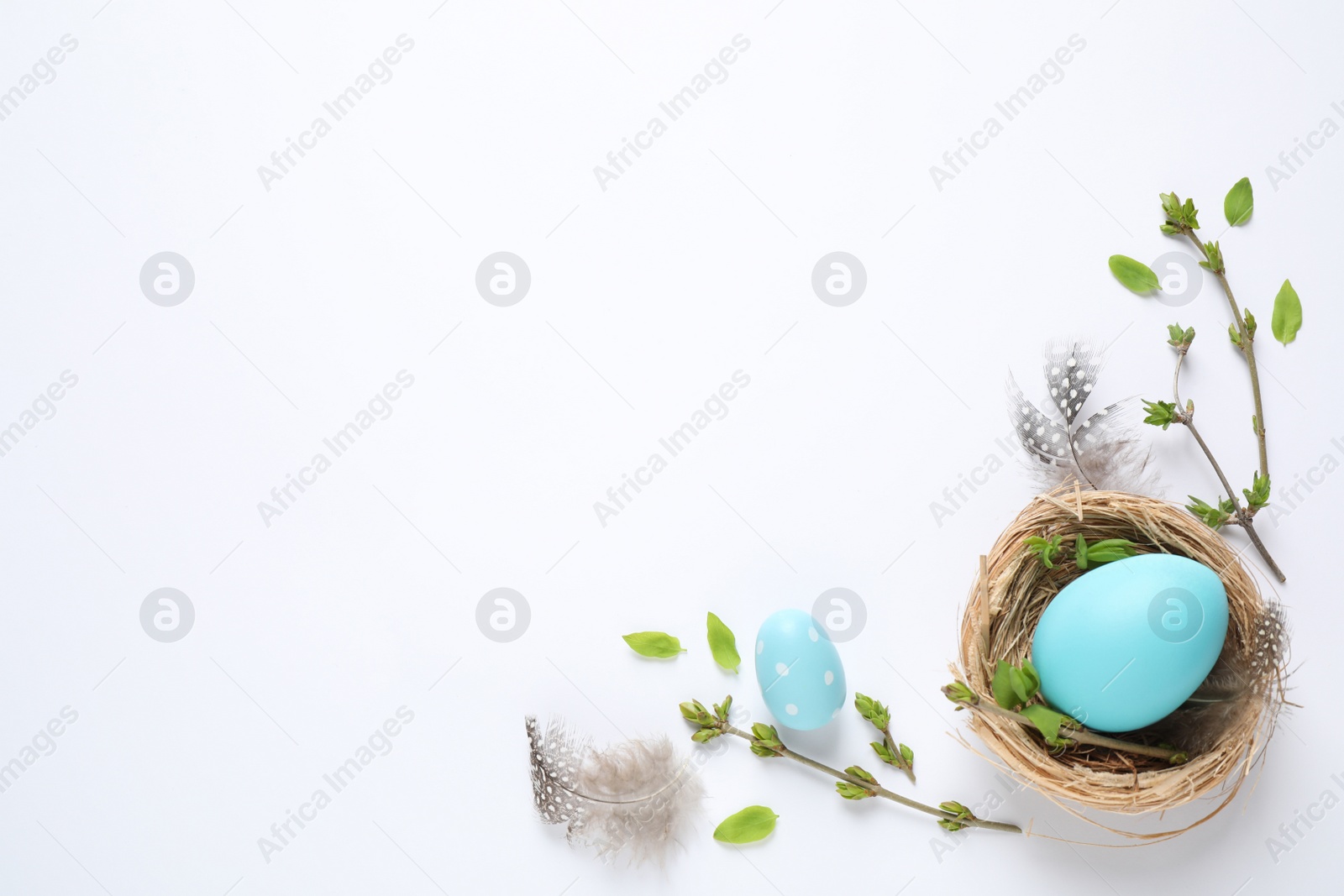 Photo of Flat lay composition with Easter eggs on white background. Space for text