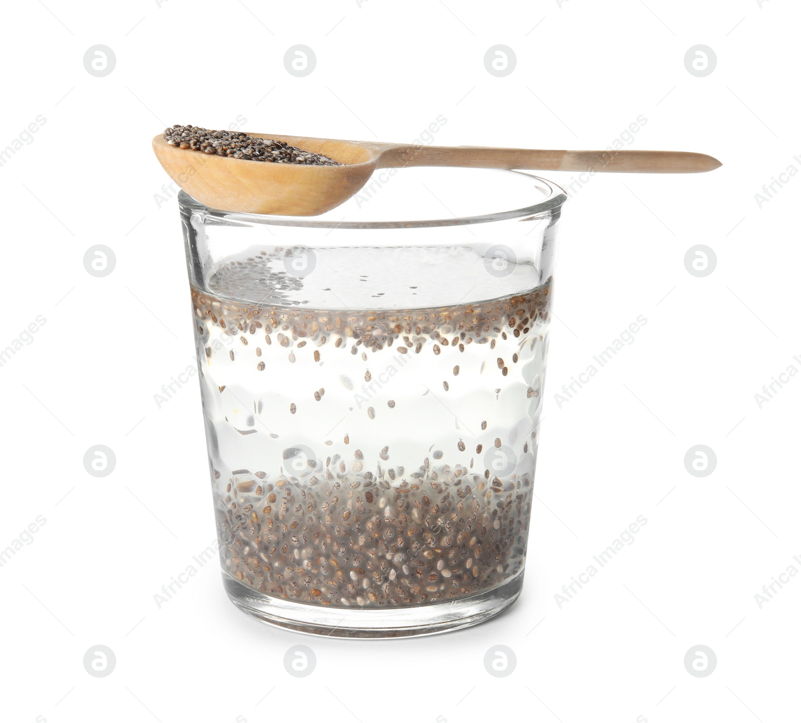 Photo of Glass of water with chia seeds and spoon on white background