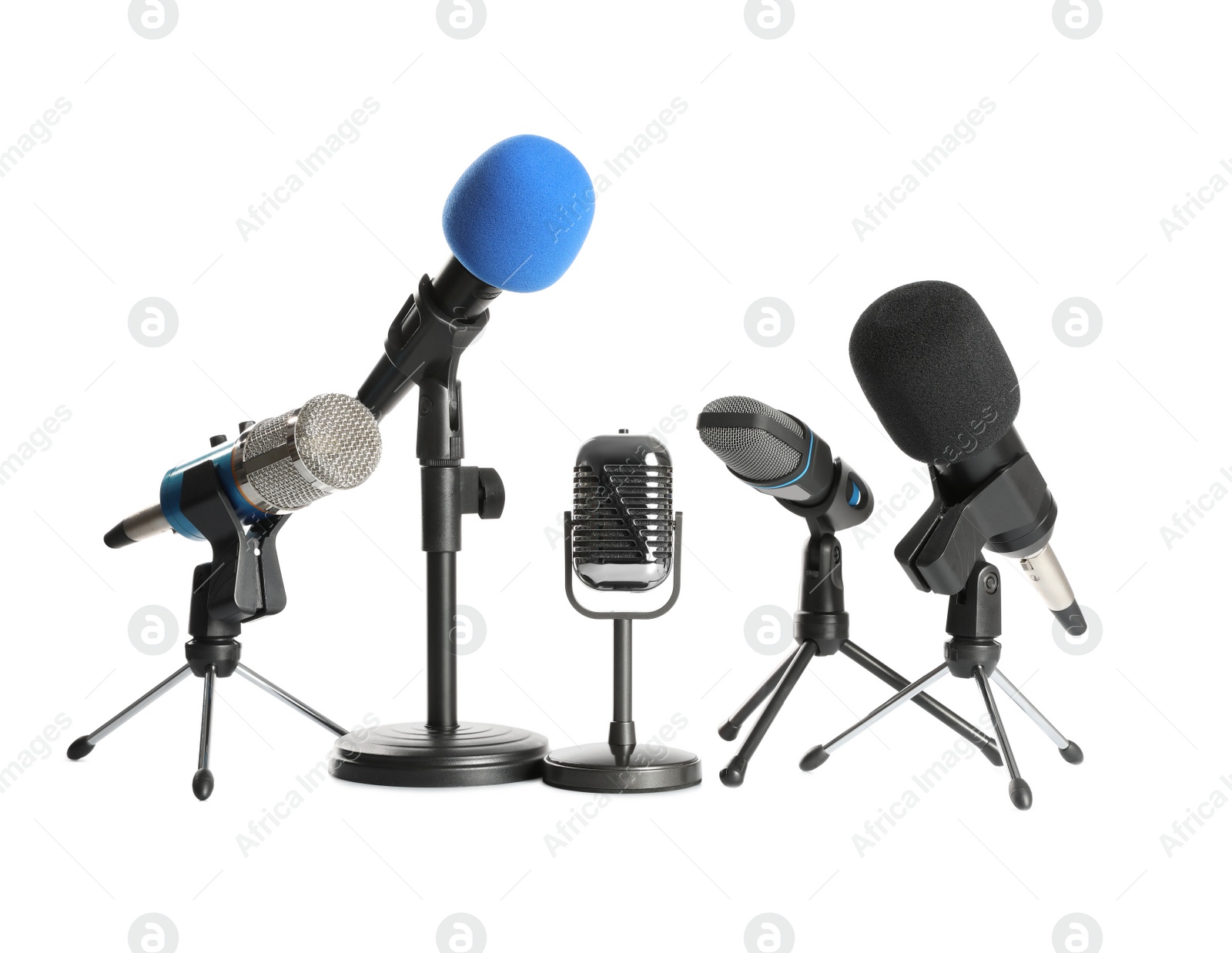 Photo of Set of different microphones isolated on white. Journalist's equipment