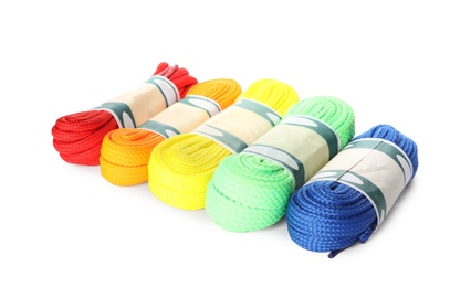 Photo of Packed colorful shoe laces on white background
