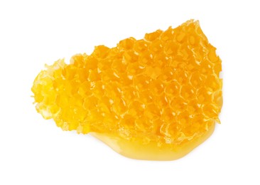 Piece of natural honeycomb with tasty honey isolated on white, top view