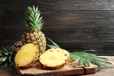 Photo of Fresh pineapple on wooden board