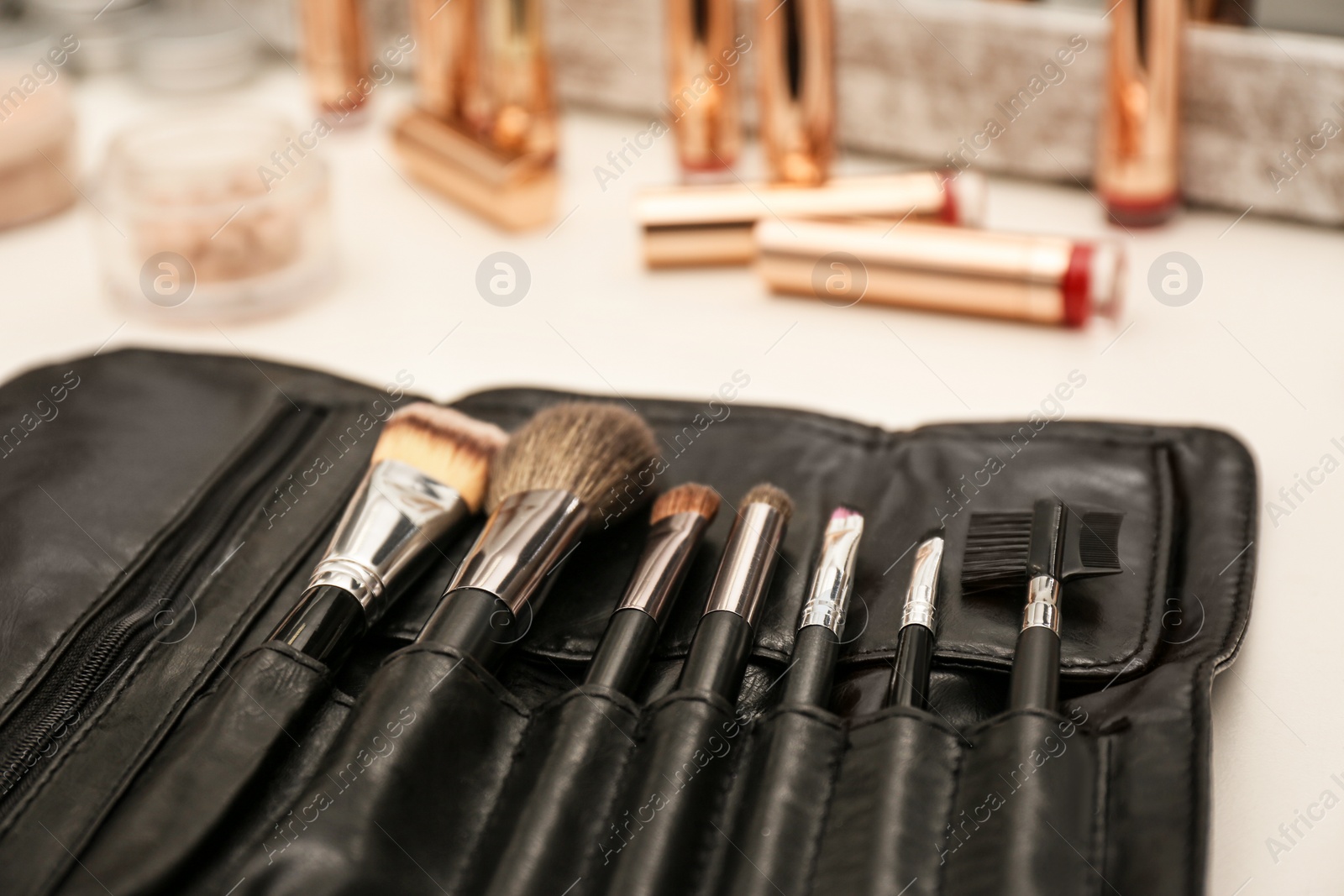 Photo of Professional makeup artists workplace with tools and cosmetic, closeup