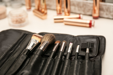 Photo of Professional makeup artists workplace with tools and cosmetic, closeup