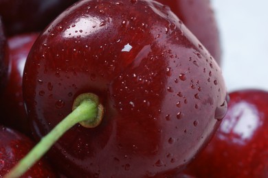 Photo of Ripe cherries with water drops as background, macro view. Fresh berry