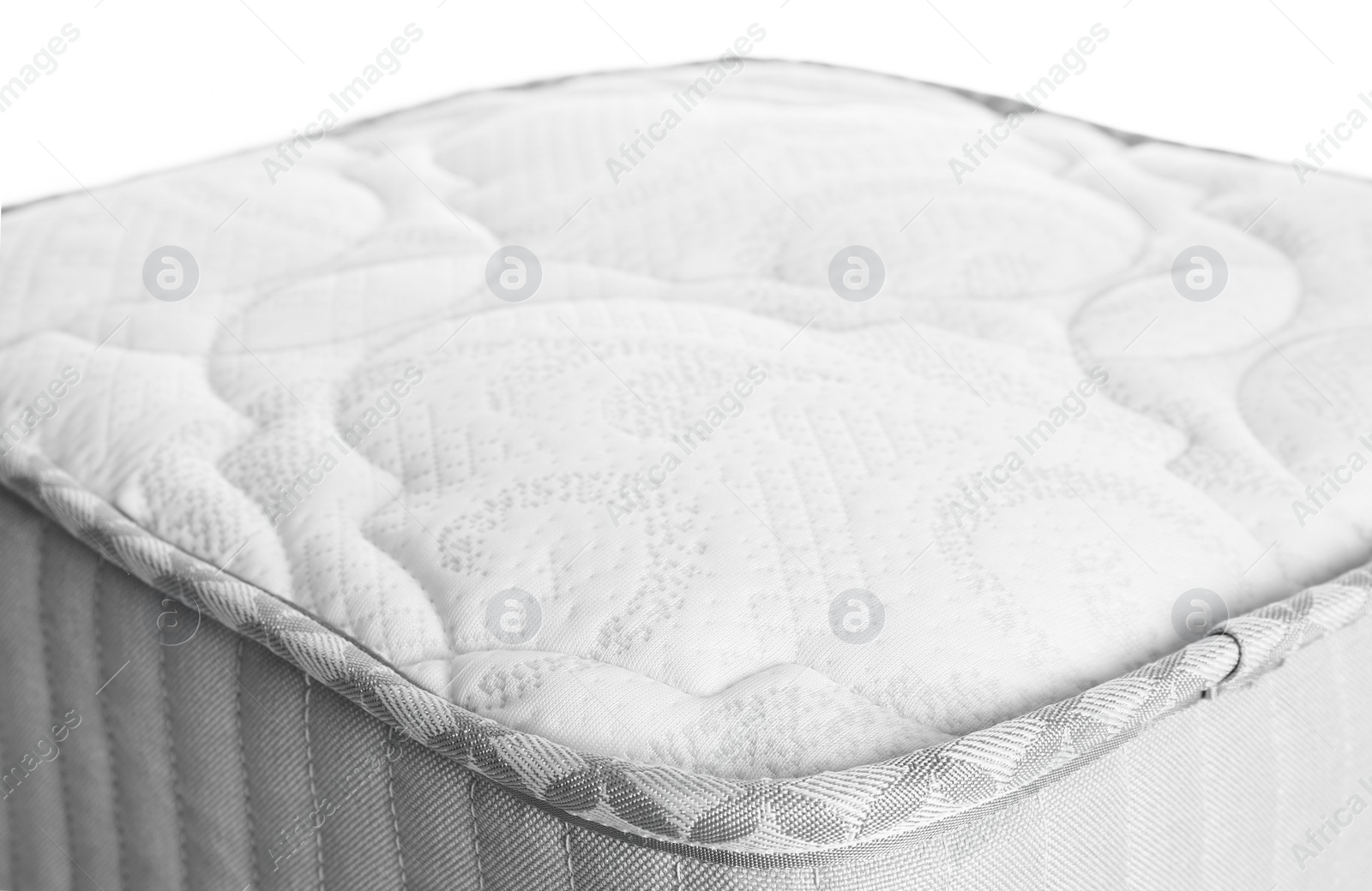 Photo of Sample of modern orthopedic mattress on white background, closeup