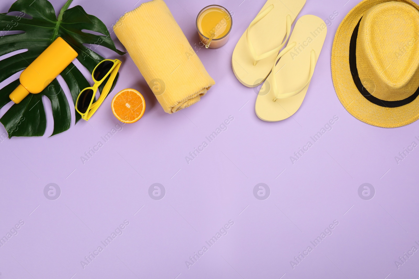 Photo of Flat lay composition with beach objects on violet background, space for text