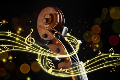 Image of Staff with music notes and symbols braiding violin head on black background, closeup. Bokeh effect