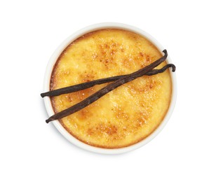 Photo of Delicious creme brulee and vanilla sticks isolated on white, top view