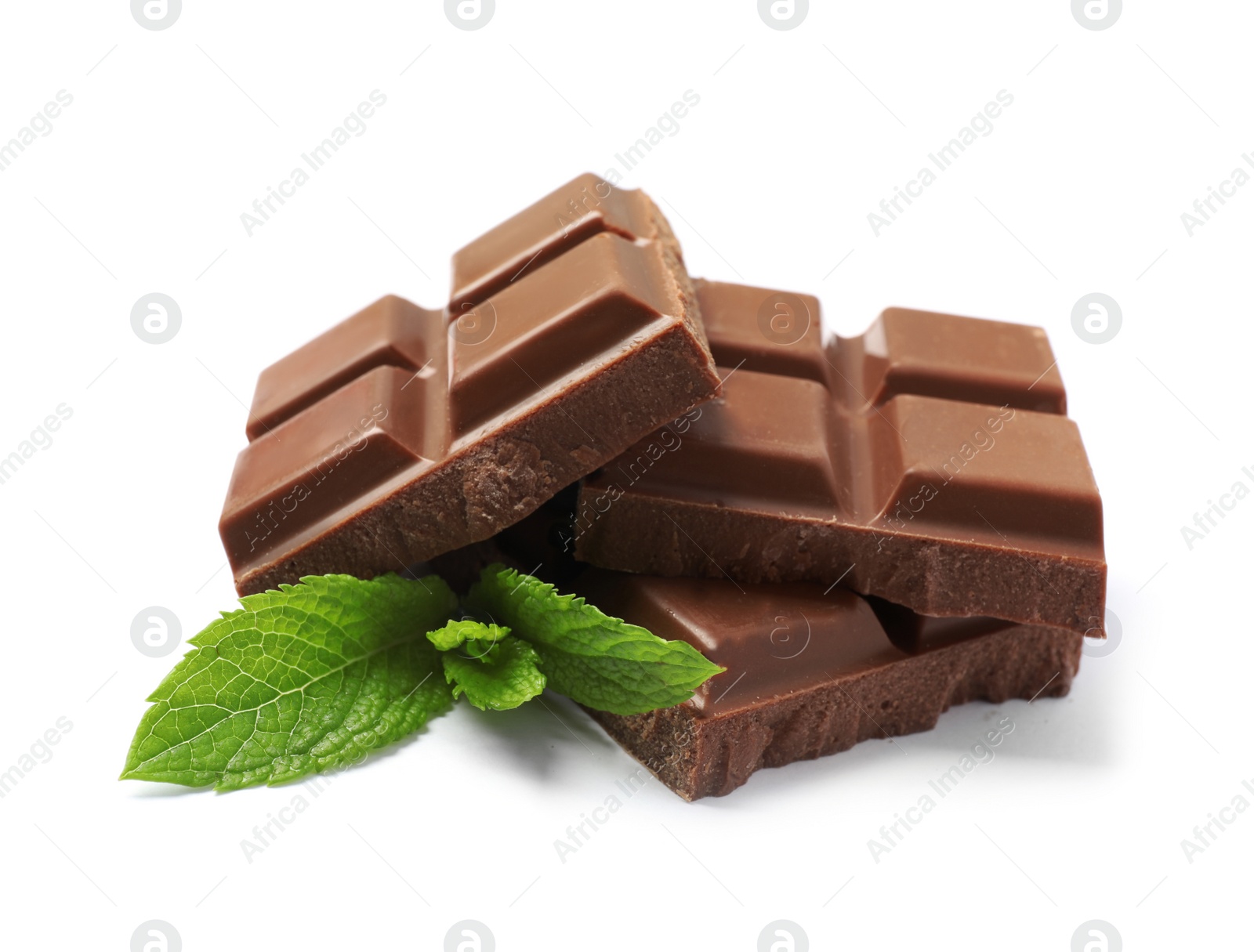 Photo of Pieces of milk chocolate with mint on white background