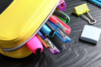 Photo of Different stationery on wooden table. Back to school