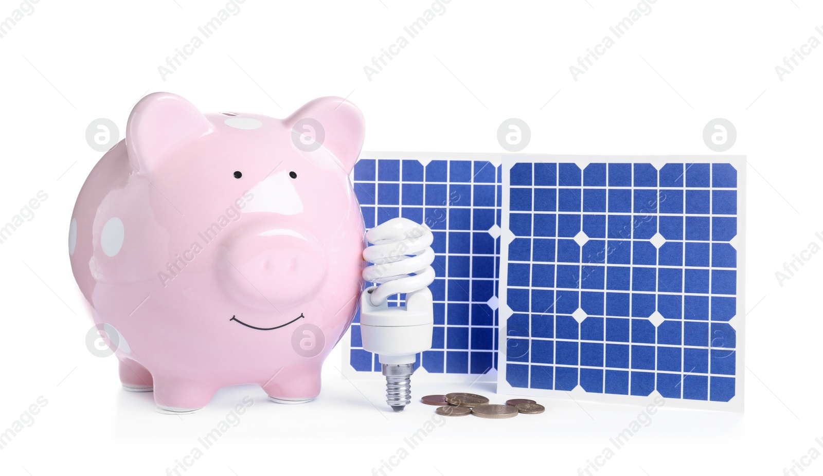 Photo of Composition with solar panels and piggy bank on white background