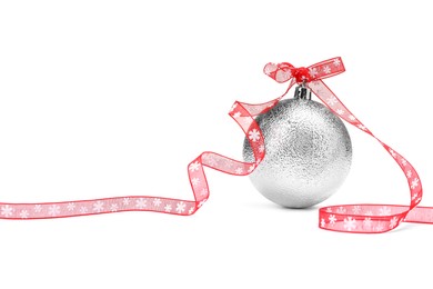 Photo of Beautiful Christmas ball with red ribbon isolated on white