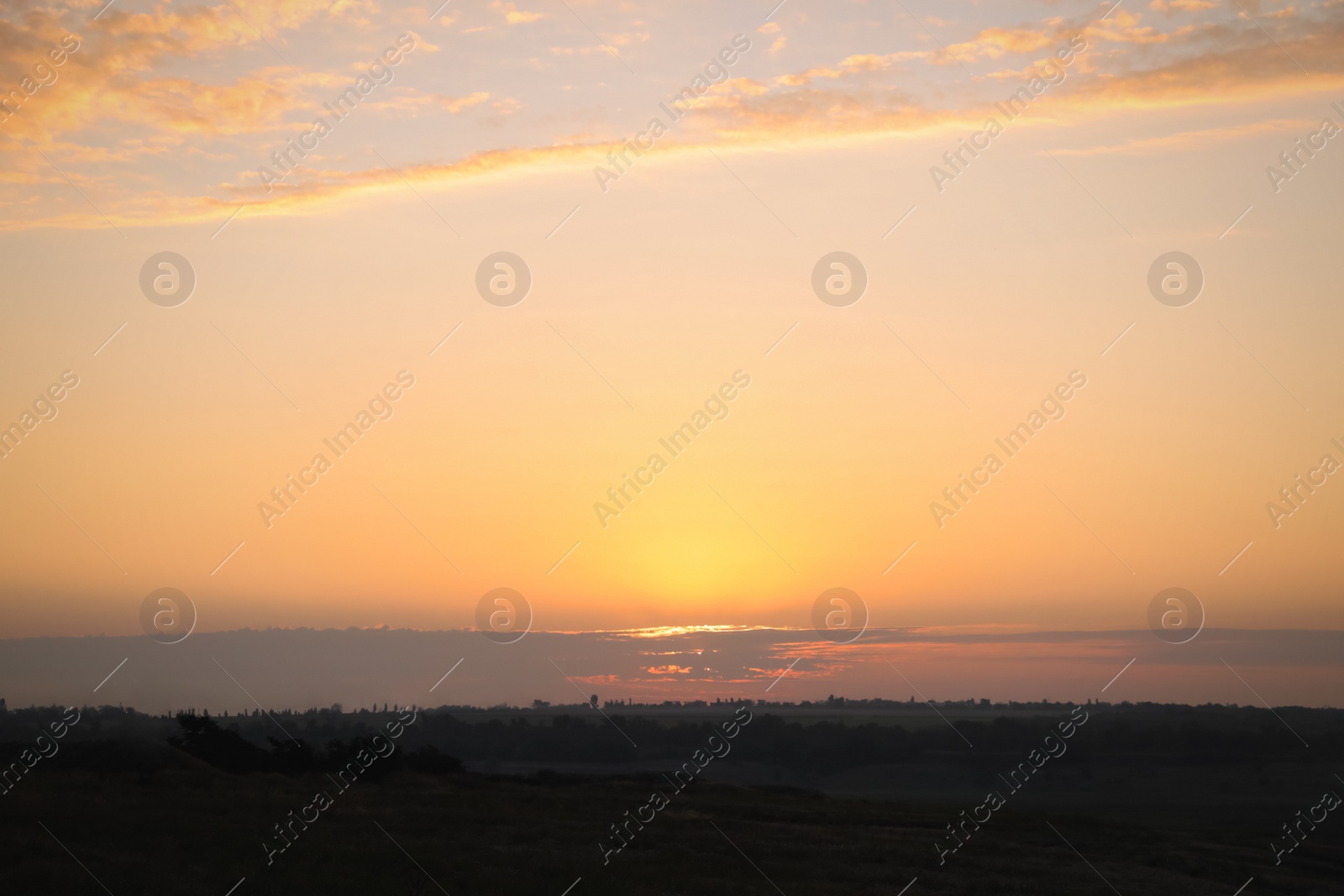 Photo of Picturesque view of beautiful sky in countryside at sunrise