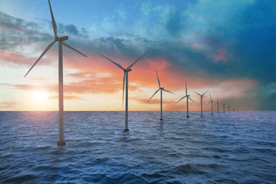 Image of Floating wind turbines installed in sea. Alternative energy source 