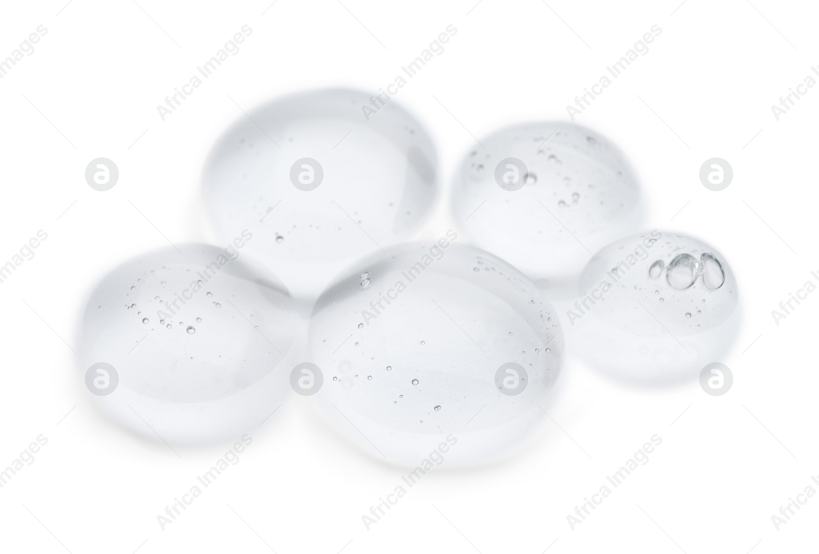 Photo of Drops of cosmetic oil on reflective surface