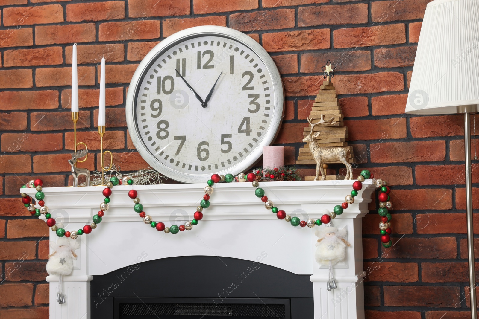 Photo of Modern fireplace decorated for Christmas in living room