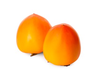 Photo of Delicious ripe juicy persimmons on white background