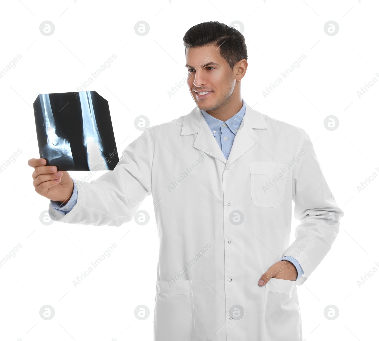 Photo of Orthopedist holding X-ray picture on white background