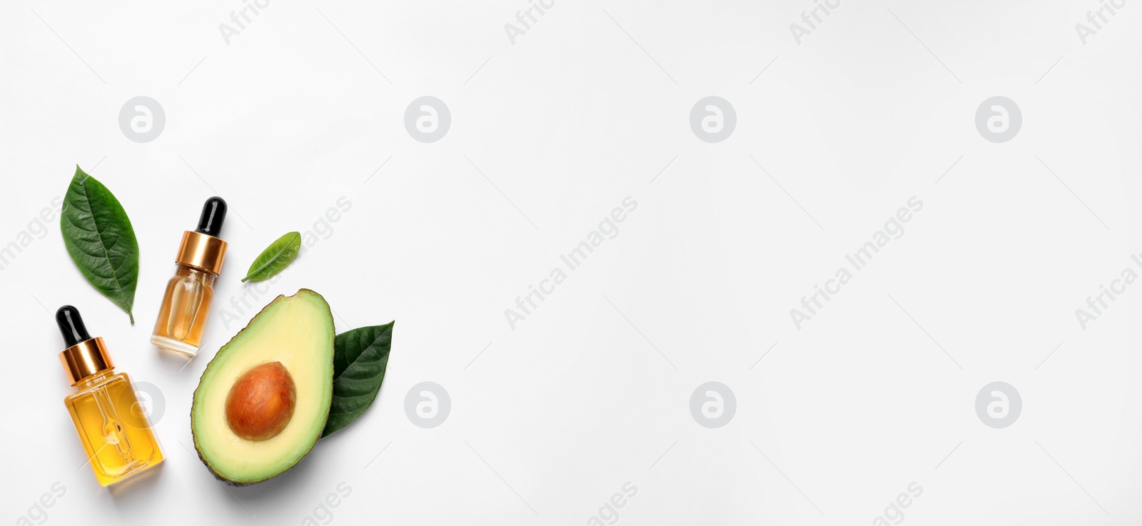 Photo of Flat lay composition with essential oil and avocado on white background. Space for text