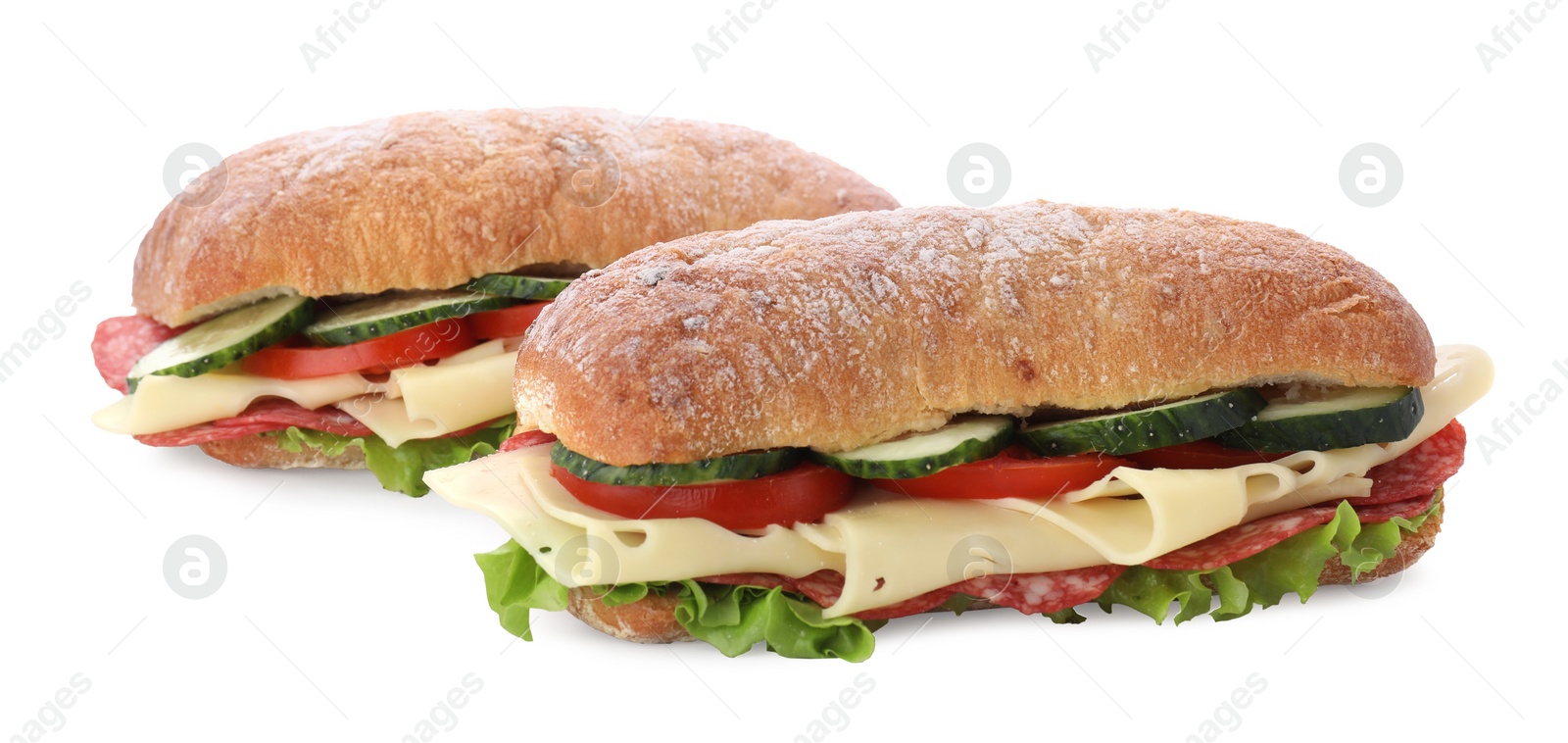 Photo of Delicious sandwiches with fresh vegetables, cheese and salami isolated on white