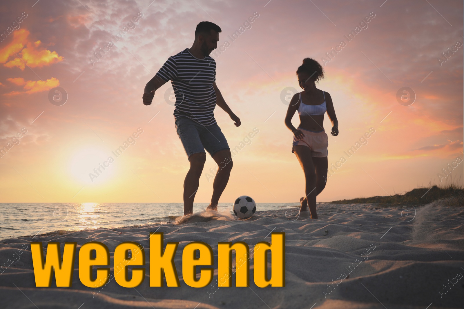 Image of Hello Weekend. Happy couple playing football on sandy beach at sunset