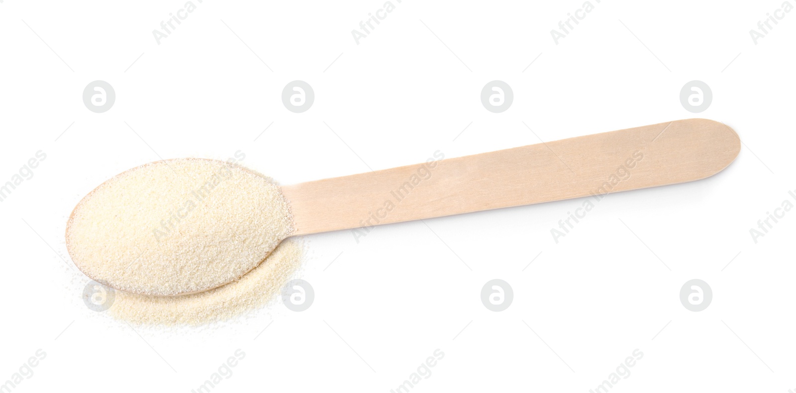 Photo of Spoon with uncooked organic semolina isolated on white, top view