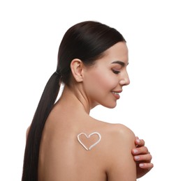 Young woman applying body cream onto her back against white background