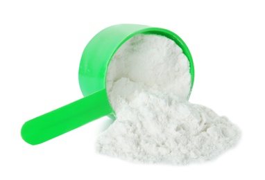 Photo of Scoop and scattered protein powder isolated on white