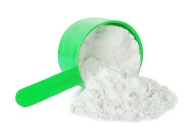 Scoop and scattered protein powder isolated on white