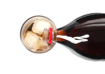 Pouring refreshing cola into glass with ice cubes on white background, top view