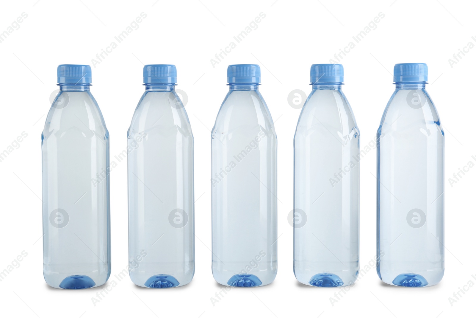 Photo of Collection of plastic bottles with water on white background