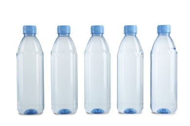 Photo of Collection of plastic bottles with water on white background