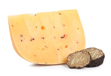 Photo of Piece of delicious cheese with cut black truffle on white background