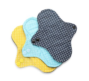 Photo of Many cloth menstrual pads on white background, top view. Reusable female hygiene product