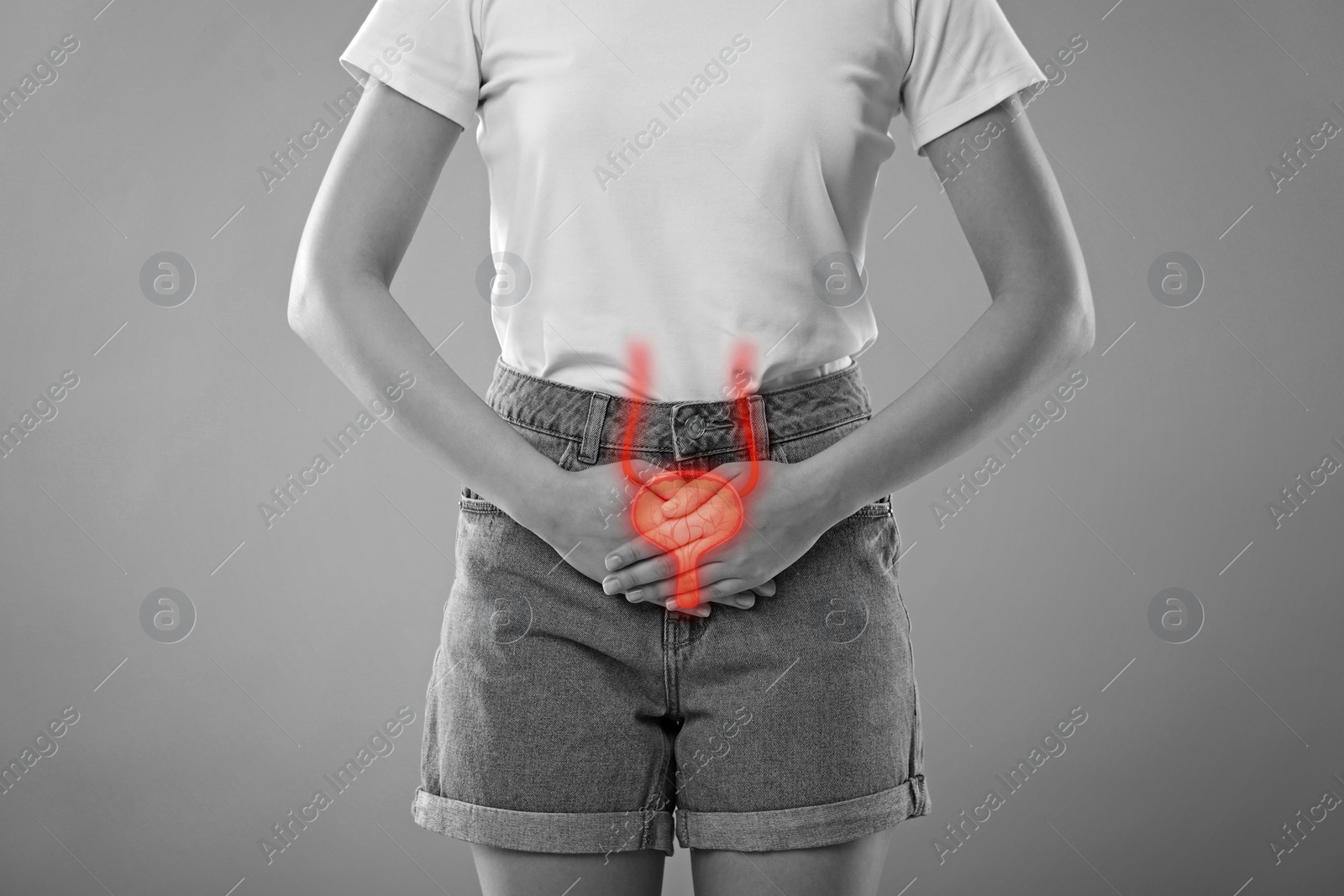 Image of Woman suffering from cystitis on light grey background, closeup. Illustration of urinary system